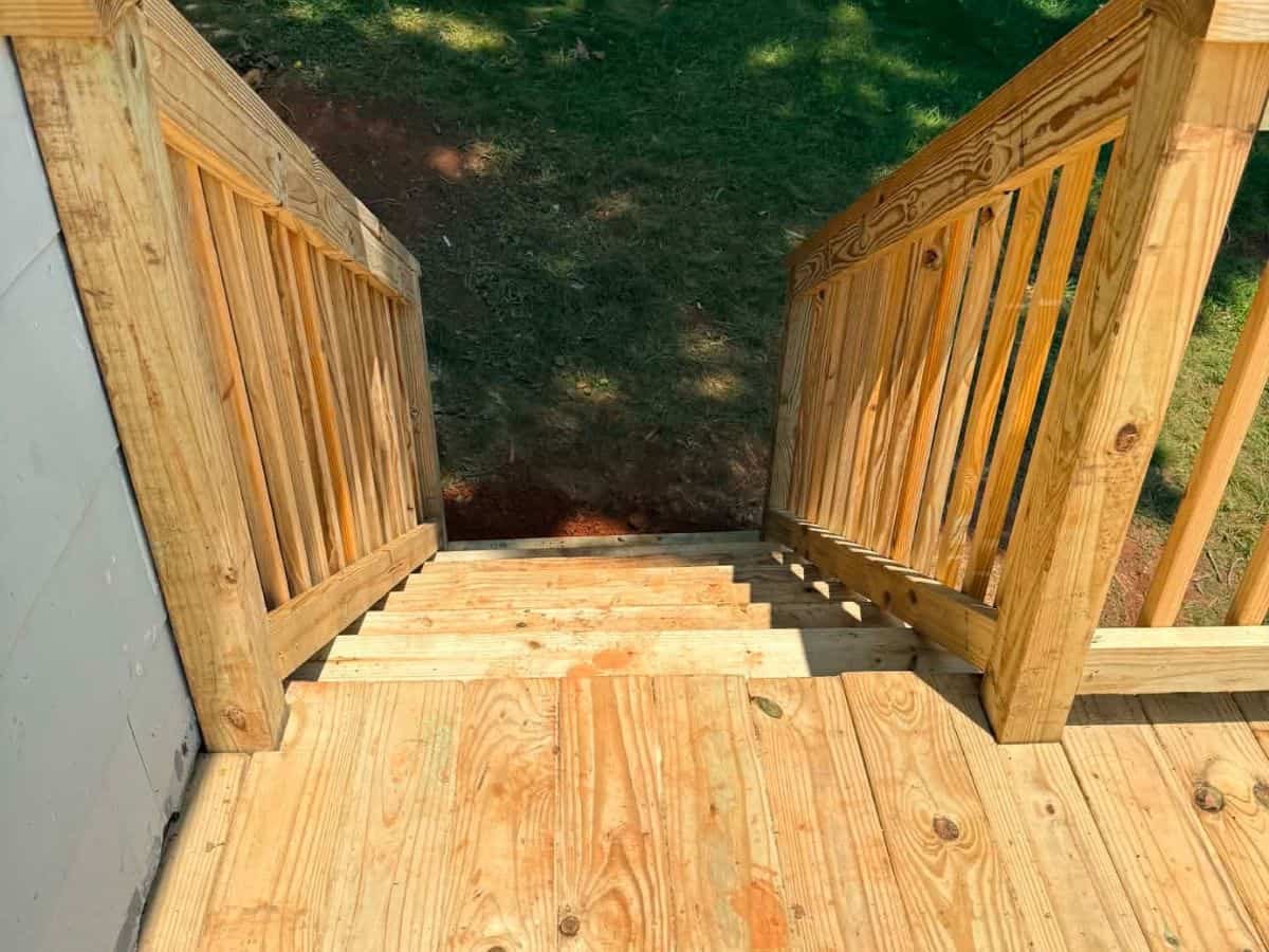 Wood porch interior railing Asheville NC by Brothers Fence Solutions